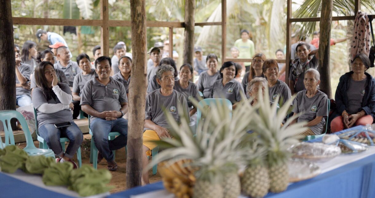People at a farm listening